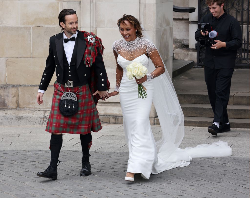 Rory McPhee and Mel B walking hand in hand