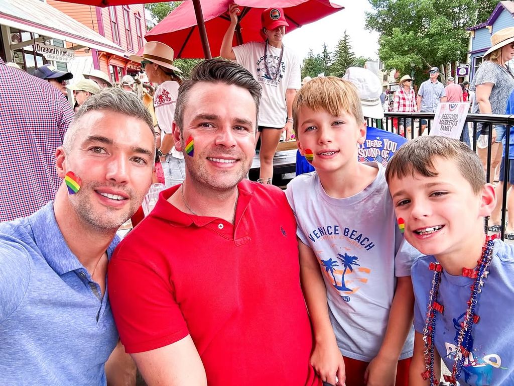 Jason Hanna, Joe Riggs and their twin sons Lucas and Ethan pose for a photo during a Pride celebration, shared on Instagram