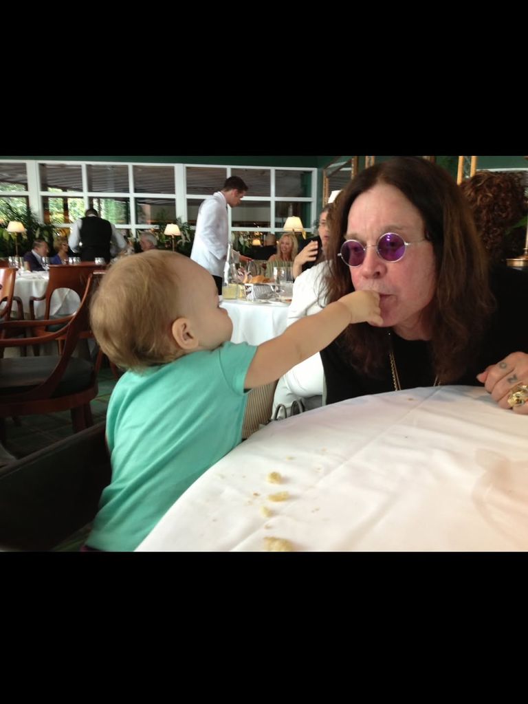 ozzy osbourne with grandchild at table