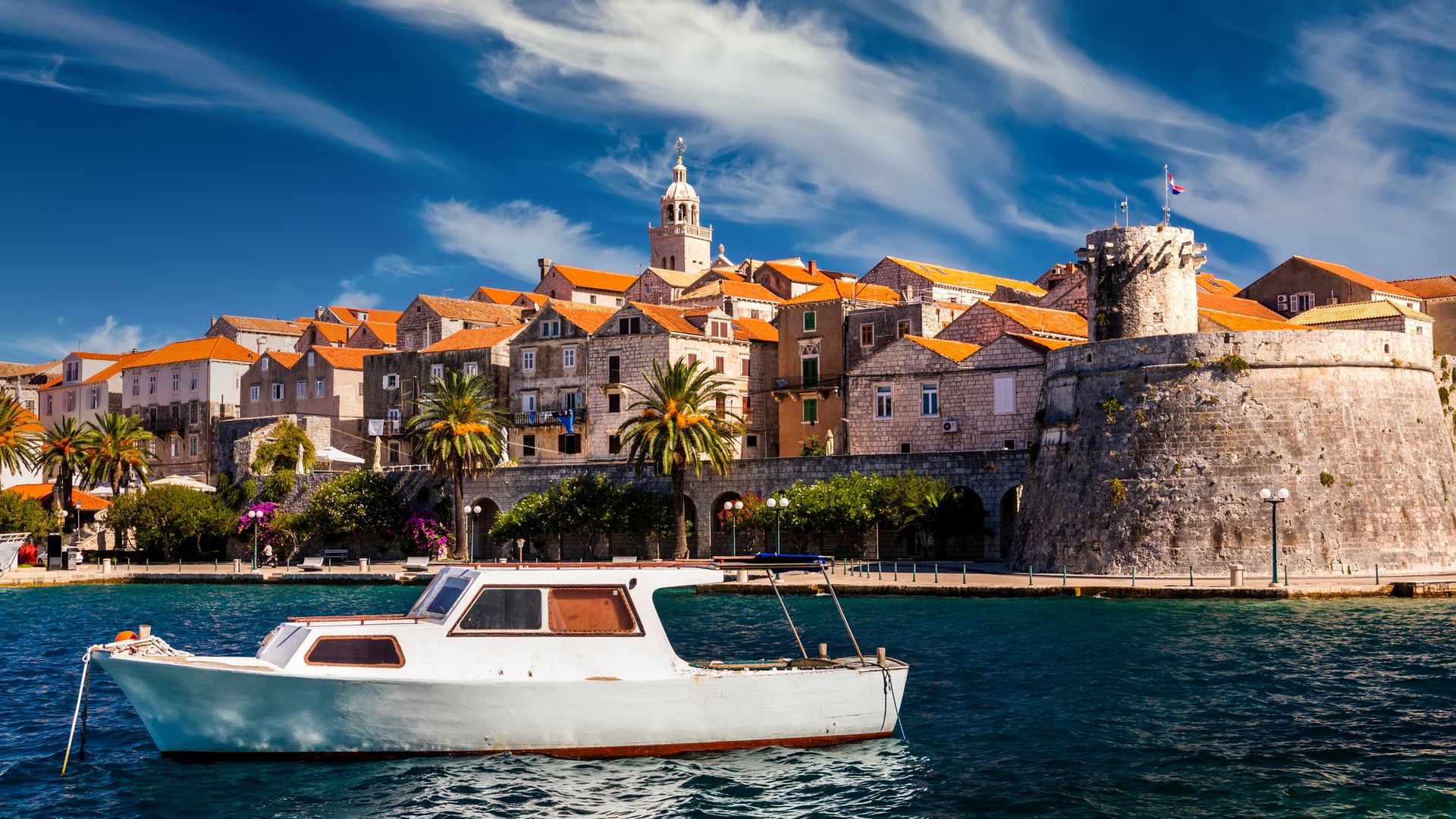 A boat outside a fortified town in Croatia