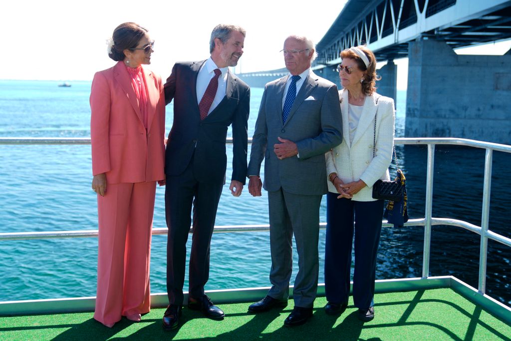 The Danish and Swedish royals standing in front of the Øresund Bridge