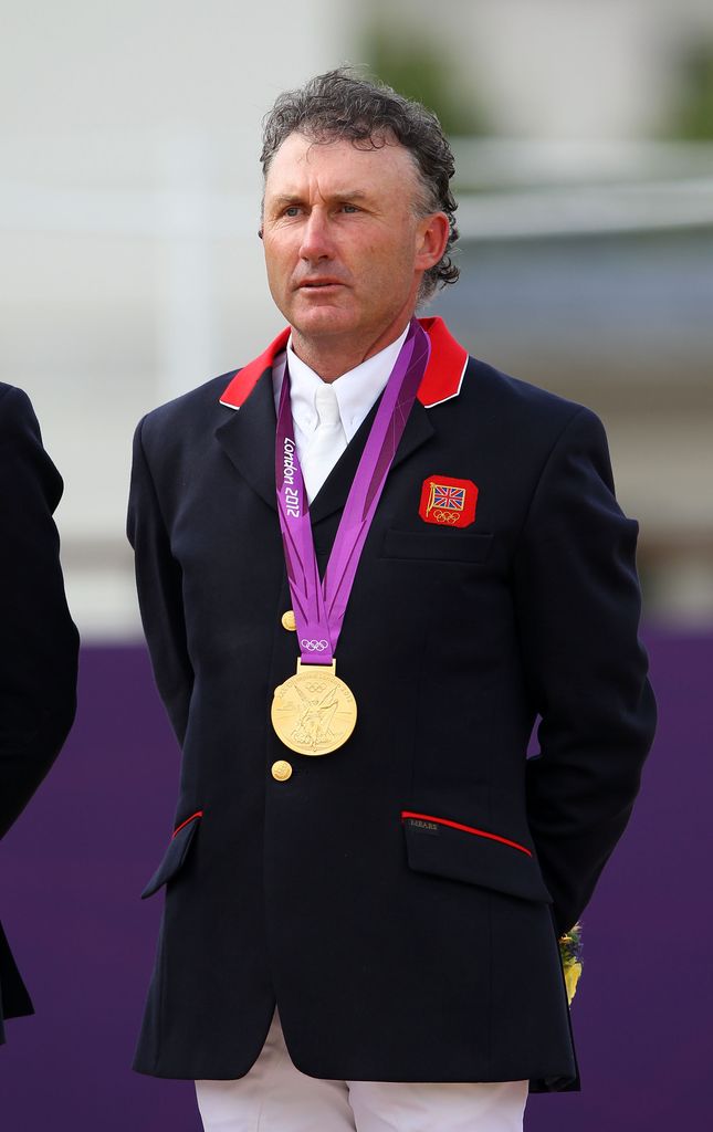 peter charles wearing olympic gold medal