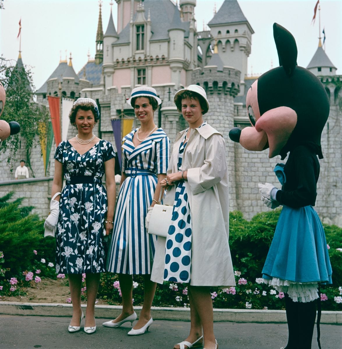 Left to right: Princess Astrid of Norway, Princess Margaretha of Sweden and Princess Margaretha of Denmark (later Queen Margrethe II) in front of Sleeping Beauty's Castle at Disneyland, Anaheim, California, June 1960.