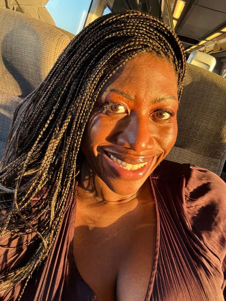 selfie of ateh jewel smiling in golden sunlight 