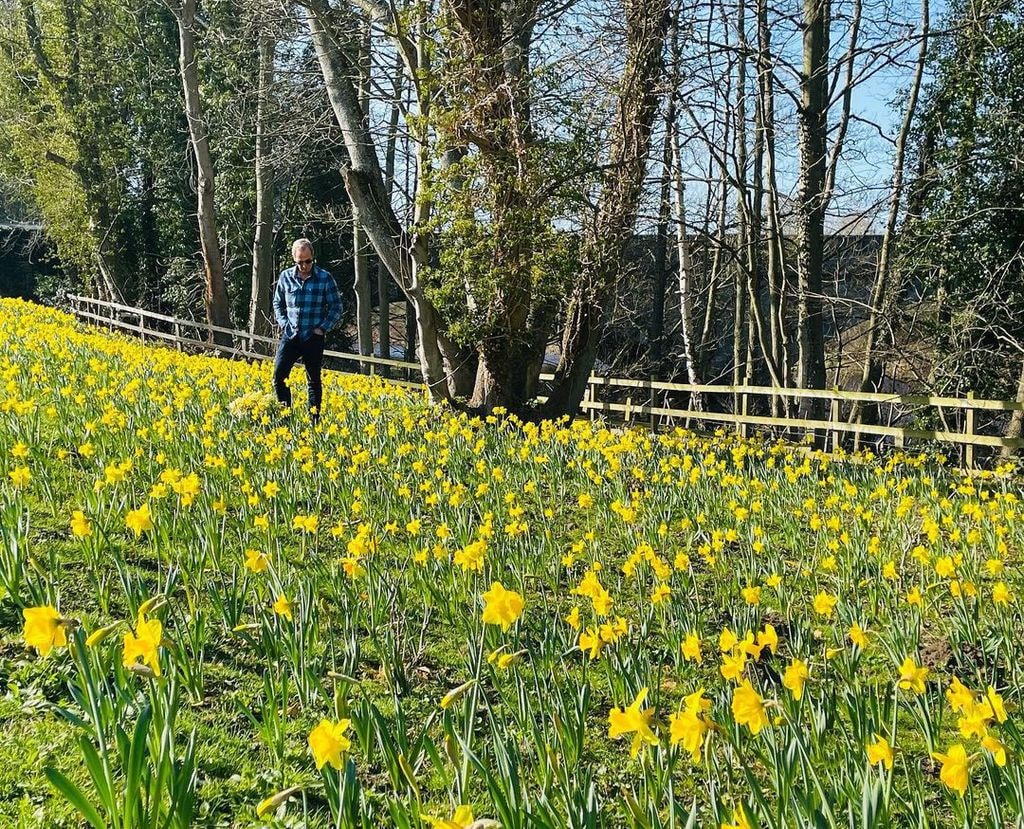 Robson in the stunning garden at his riverside home in Northumberland