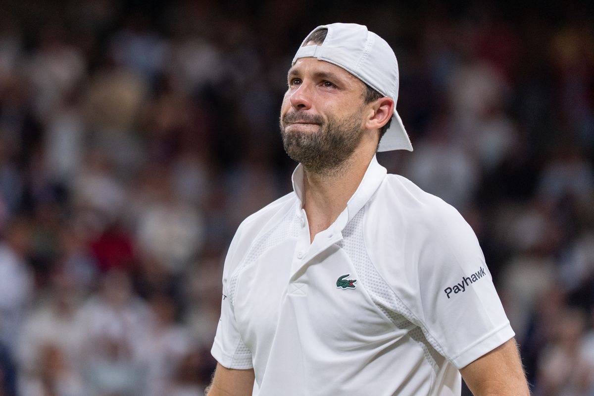 Grigor Dimitrov of Bulgaria is crying after he retired during Day Eight of The Championships Wimbledon 2025 