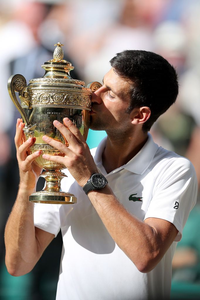 Novak Djokovic kissing wimbledon trophy 