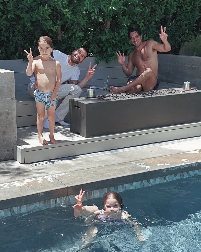 Ricky Martin and Jwan Yosef pose for a photo by the pool with their kids Renn and Lucia, shared on Instagram