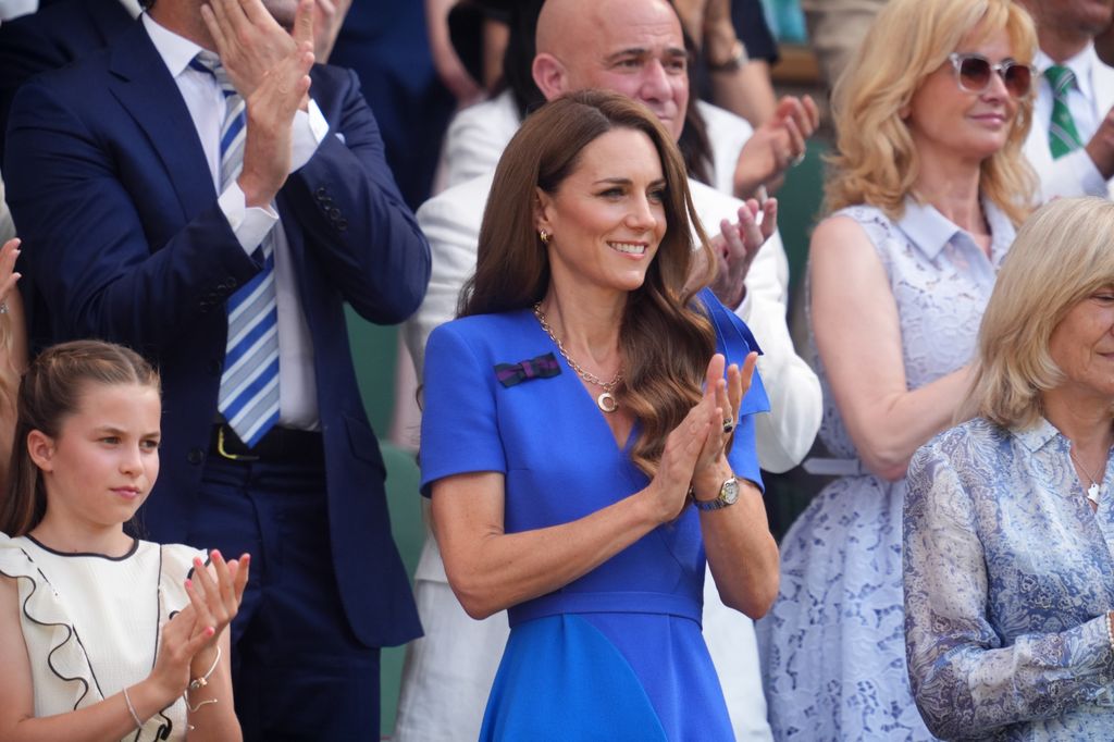 Charlotte and Kate standing and clapping