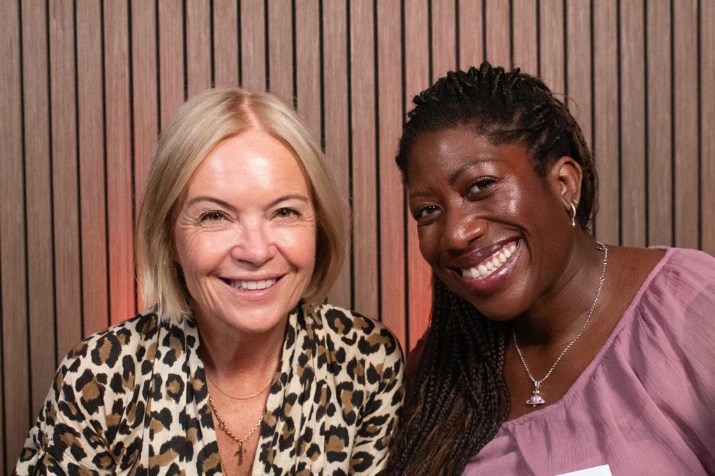 Mariella Frostrup and Ateh Jewel smiling in a wood panelled room