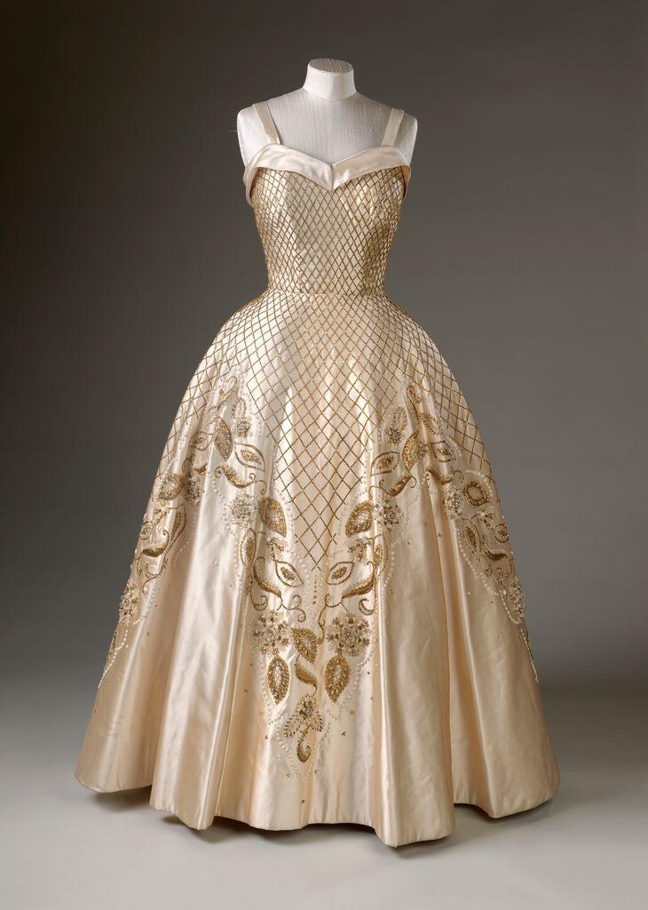 A close up of the monarch's evening gown by Norman Hartnell from 1956