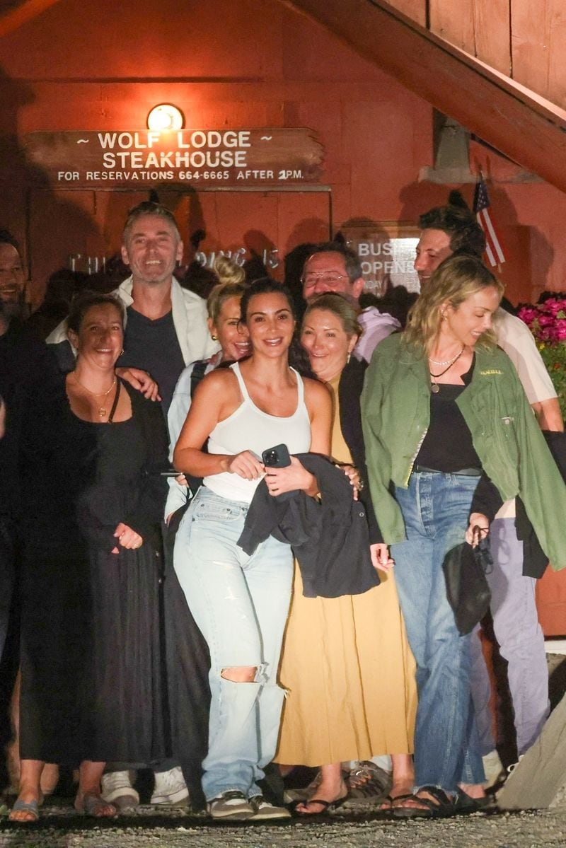 

A happy Kim Kardashian takes pictures after a casual dinner with friends at Wolf Lodge Steakhouse in Coeur d'Alene, Idaho. 