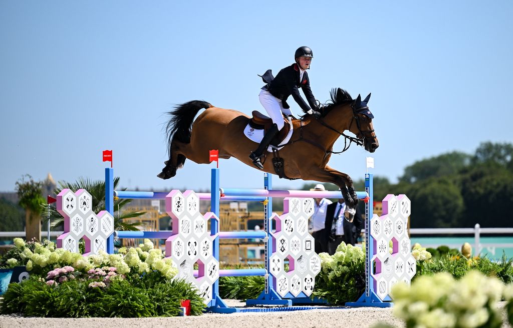 harry charles on a horse jumping 