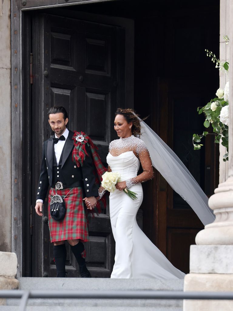 couple exiting st paul's cathedral after wedding