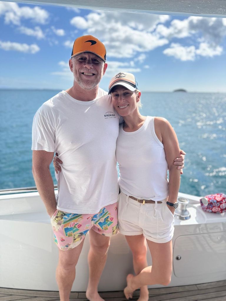 Mike and Zara tindall in white clothes on a boat in Australia 
