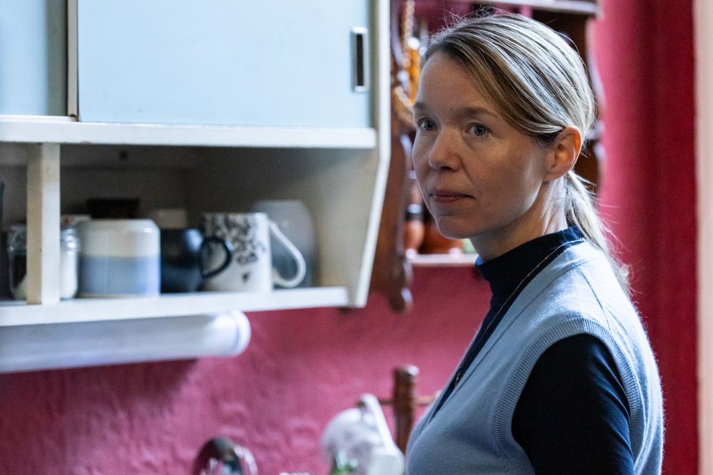 lose-up of woman standing in kitchen