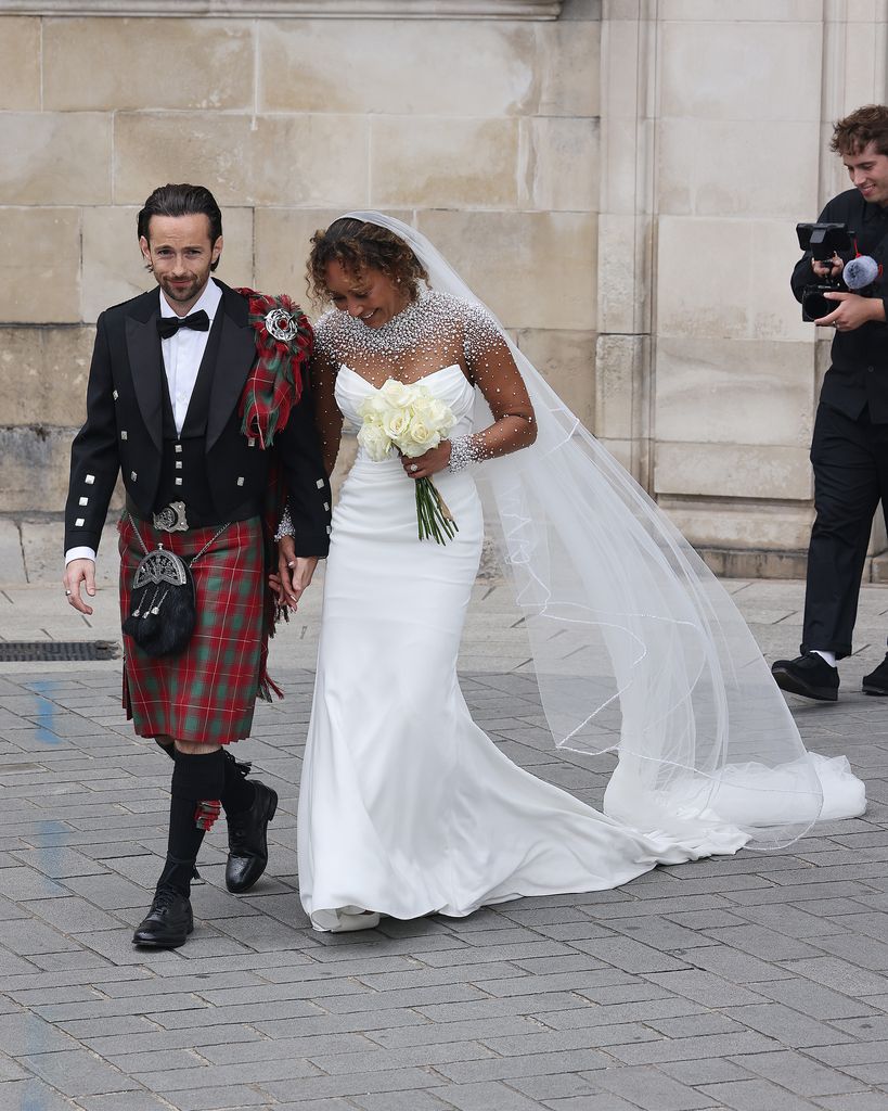 Newlyweds Rory McPhee and Mel B depart St Paul's Cathedral after their wedding 