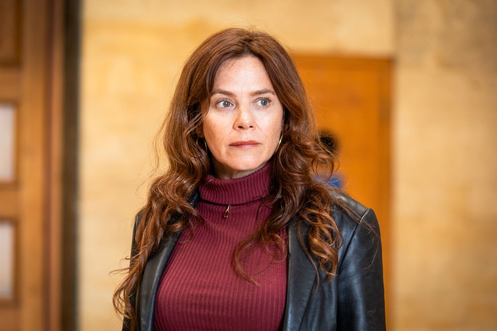 close-up of brunette woman in black jacket