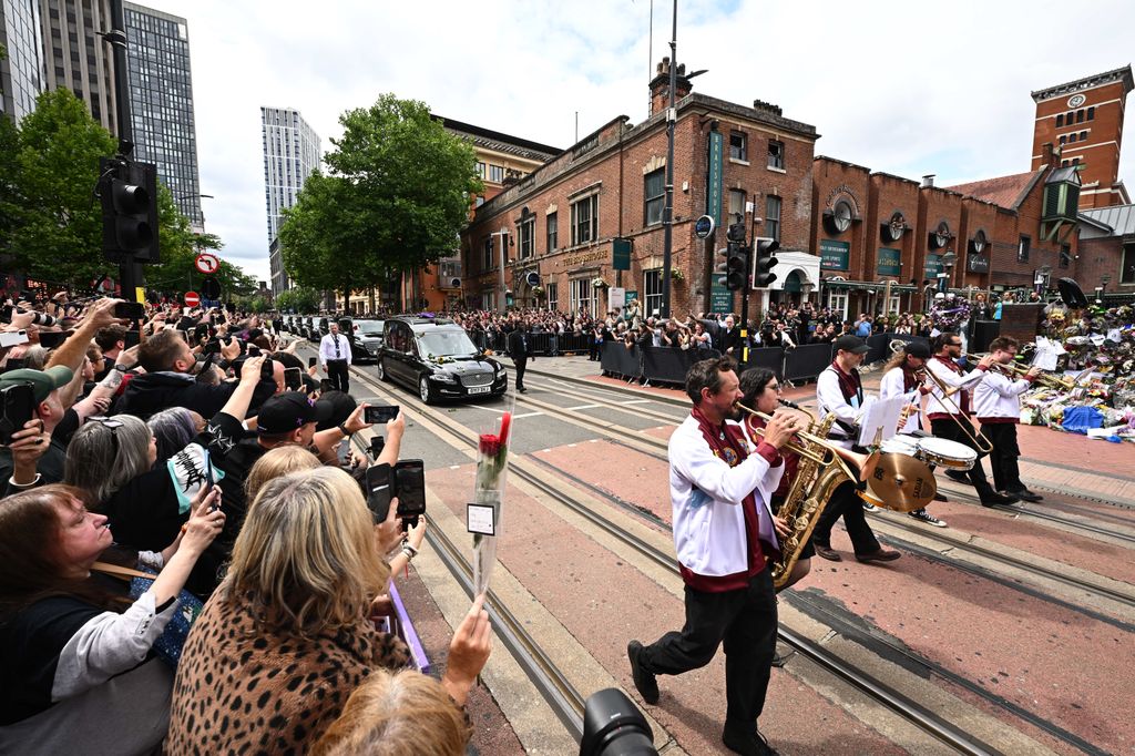 Musicians lead Ozzy Osbourne's funeral cortege through his home city of Birmingham