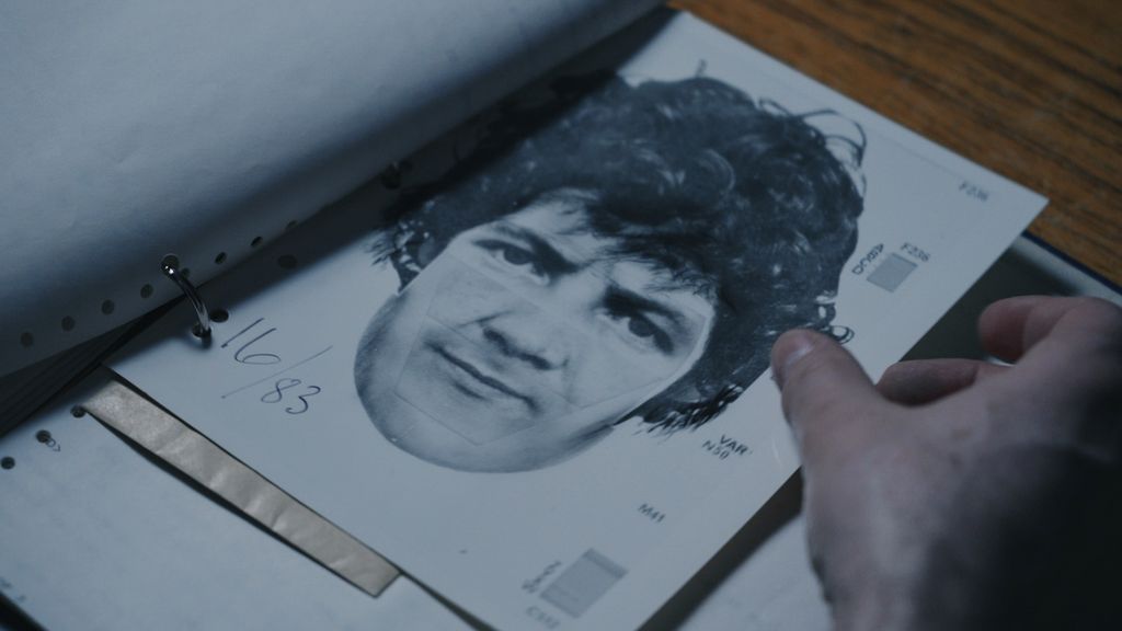 A 1983 e-fit of man with dark curly hair