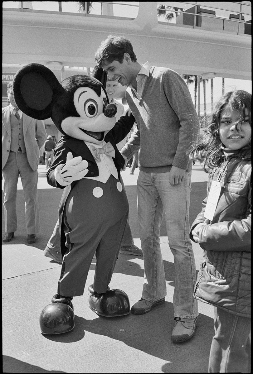 Prince Andrew ORLANDO, FLORIDA - 01/01/1980: Prince Andrew, the Duke of York, taking time of from his duties as an officer with the British Navy stationed in Fort Lauderdale with the aircraft carrier HMS Hermes visit to Florida to get in some sightseeing and tour the Disneyland theme park in Orlando, Florida, where he met Mickey Mouse amongst other attractions in the world famous resort. (Photo by Derek Hudson/Getty Images)