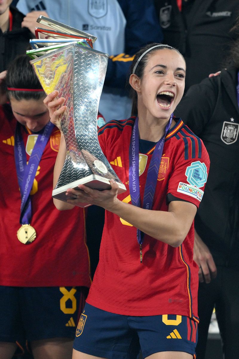 Aitana Bonmati of Spain lifts the UEFA Women's Nations League trophy after victory during the UEFA Women's Nations League 2024 Final match between Spain and France.