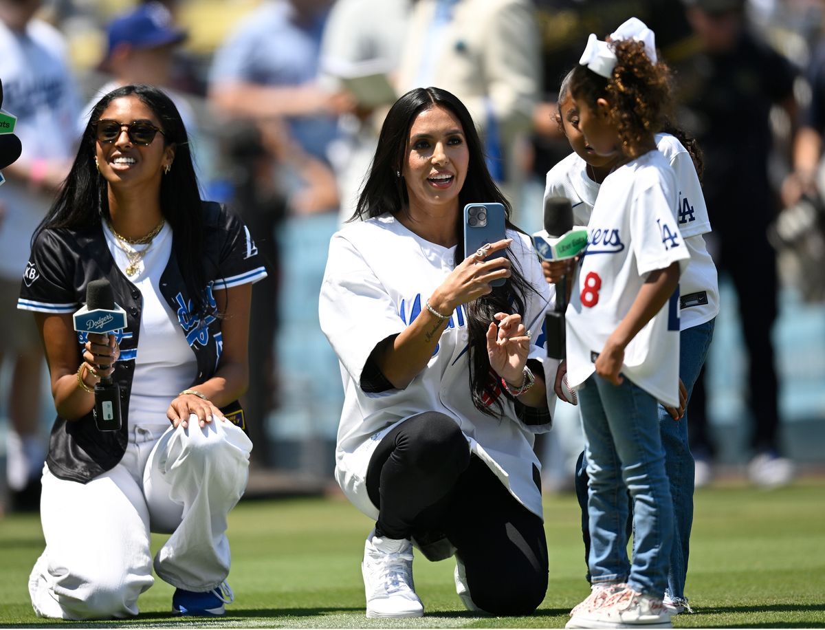 Natalia, left, her mother Vanessa and Capri Bryant, Bianca is hidden behind Capri, get ready to announce the start of a MLB baseball game between the Tampa Bay Rays and the Los Angeles Dodgers at Dodger Stadium in LOS ANGELES, CA - AUGUST 25: (Photo by John McCoy/Icon Sportswire via Getty Images)