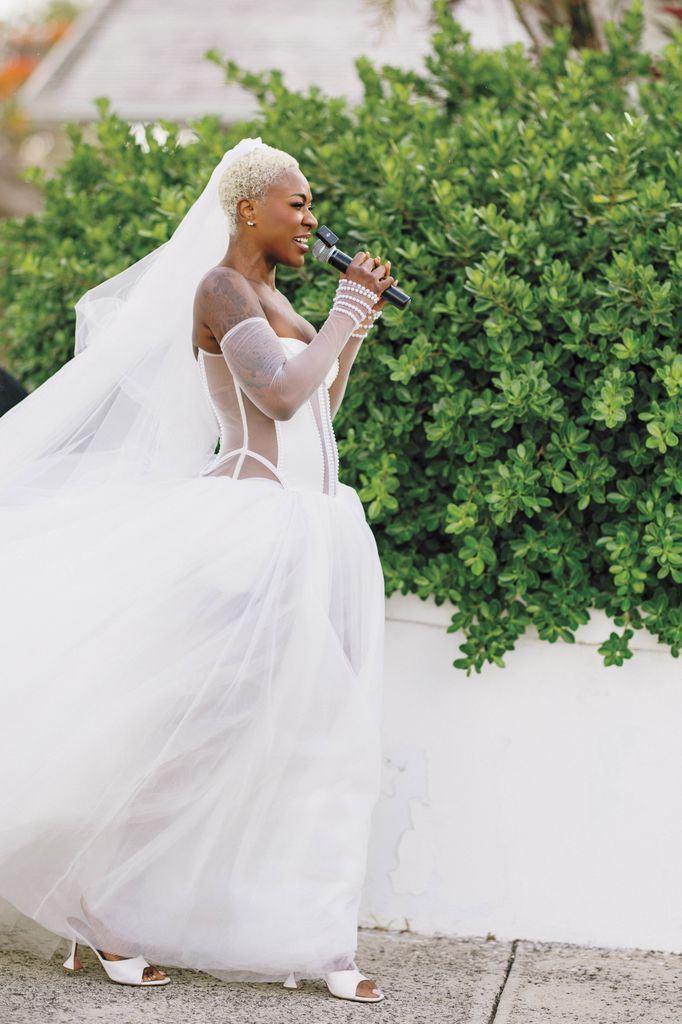 Surprise! Jully walks down the aisle singing "At Last" by Etta James