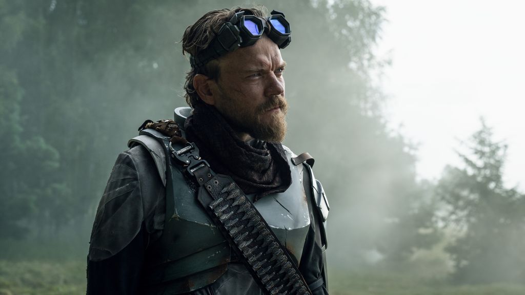 close-up of man wearing goggles in woodland
