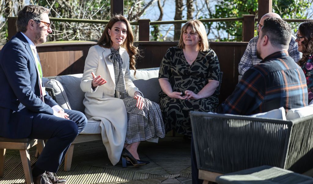 The Princess of Wales talking to group of people outside