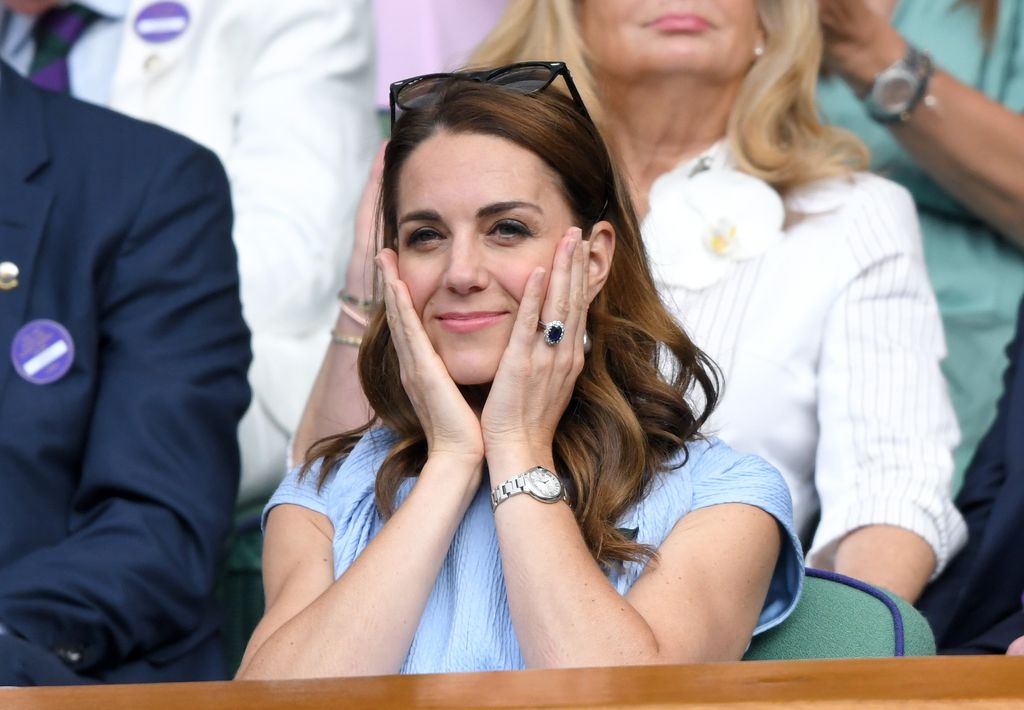 Kate Middleton holds hands to face at Wimbledon 2019