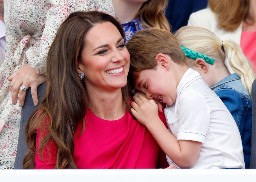Prince Louis hugging Kate Middleton
