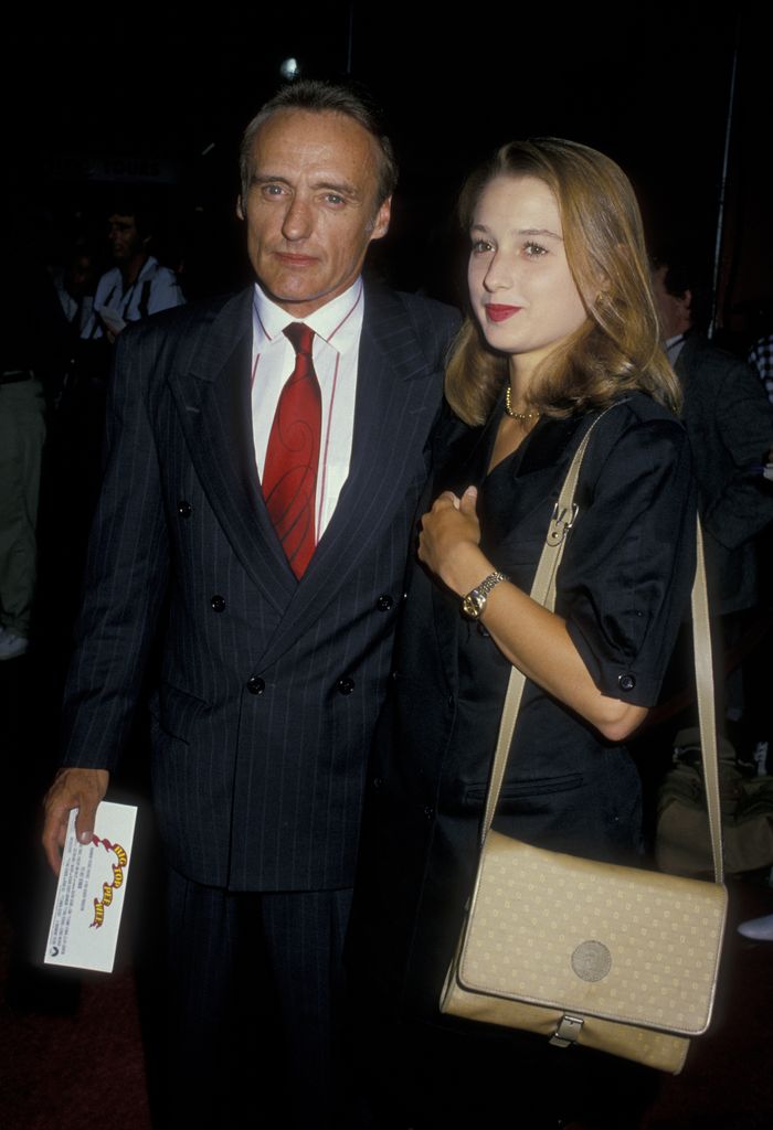 Actor Dennis Hopper and wife Katherine LaNasa attend the premiere of 'Big Top Pee Wee' on July 21, 1988 