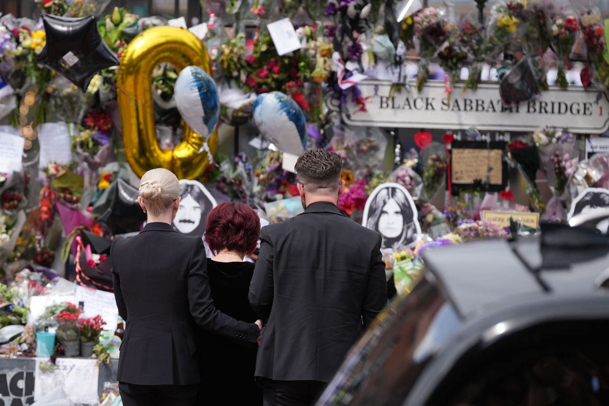 Kelly Osbourne, Sharon Osbourne, and Jack Osbourne stopped to check out the tributes left on Black Sabbath Bridge