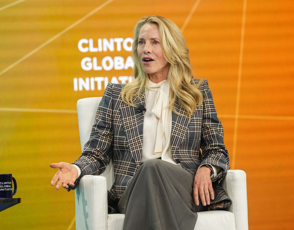 laurene powell jobs sitting in chair on stage