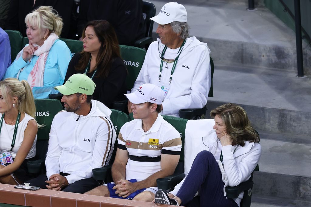 Guy Fritz (top right) coaches Taylor in tennis 