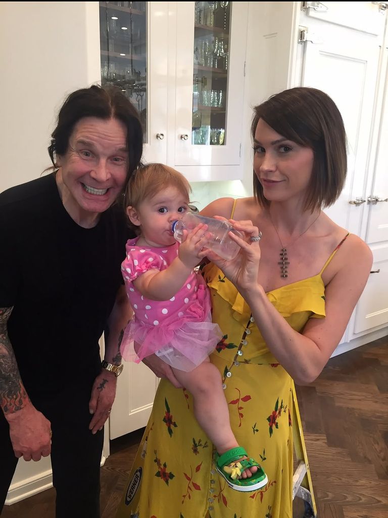 Ozzy Osbourne poses with Lisa Stelly and one of his granddaughters