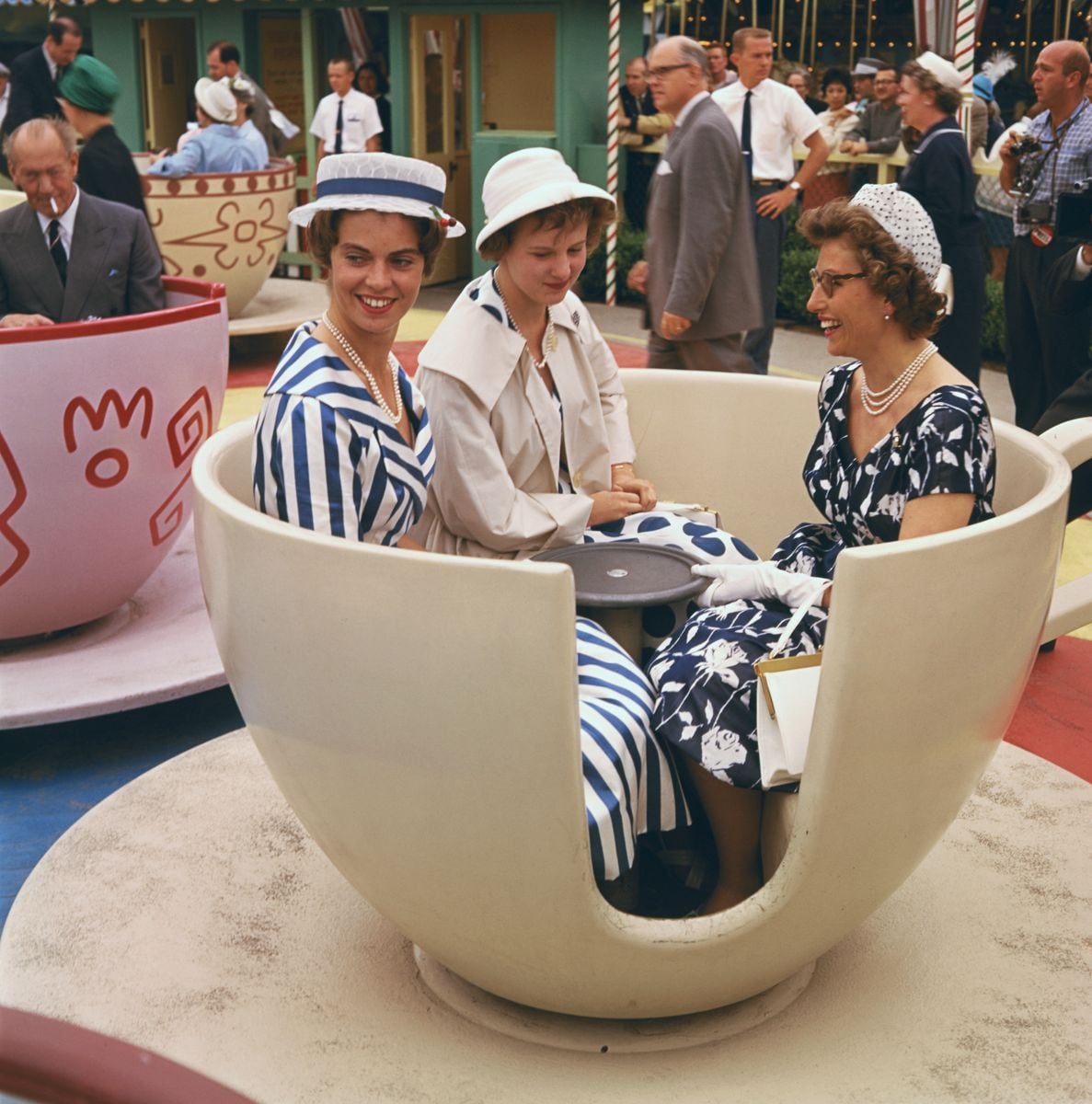 Left to right: Princess Margaretha of Sweden, Princess Margaretha of Denmark (later Queen Margrethe II) and Princess Astrid of Norway, on a teacup ride at Disneyland, Anaheim, California, June 1960.