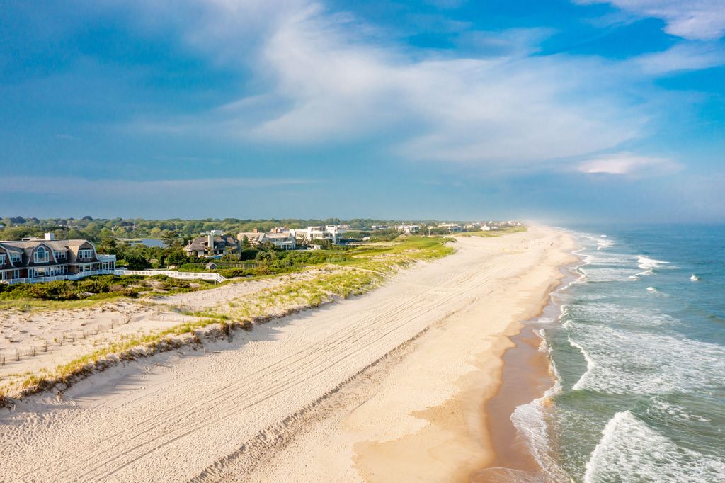 Aerial view of Cooper's Beach and the ocean front homes along Meadow Lane, Billionaire Lane, in Southampton, NY
