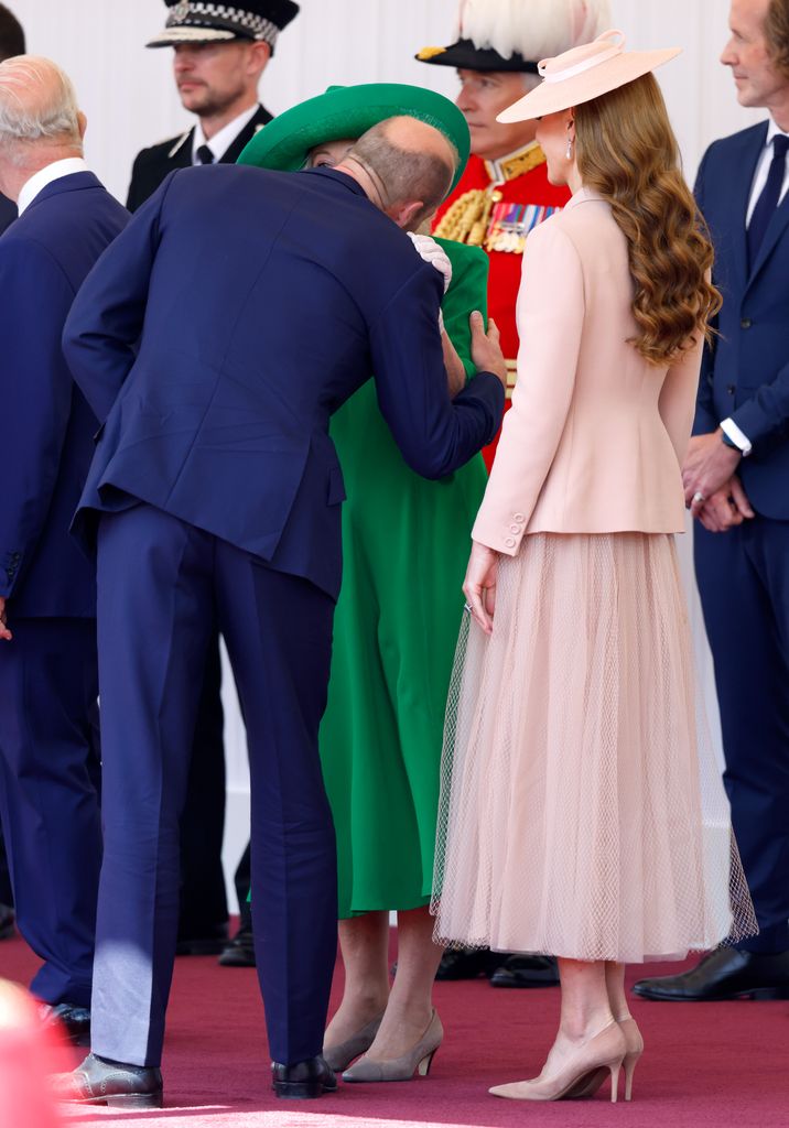 william greeting camilla with a kiss