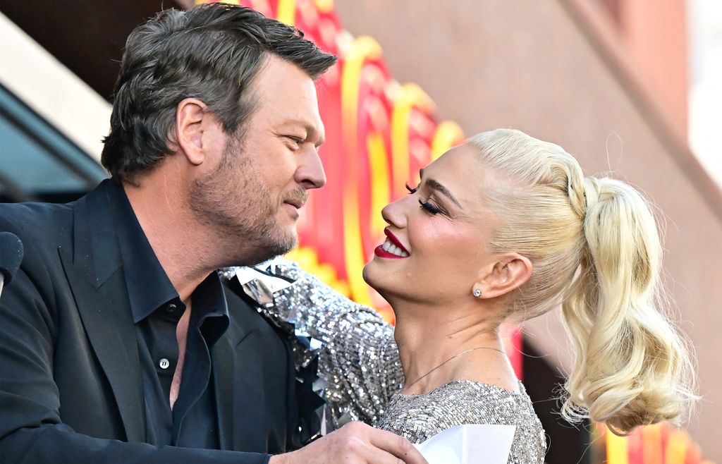 US singer Gwen Stefani and her husband US singer Blake Shelton embrace during her Hollywood Walk of Fame Star ceremony on Hollywood, California, on October 19, 2023