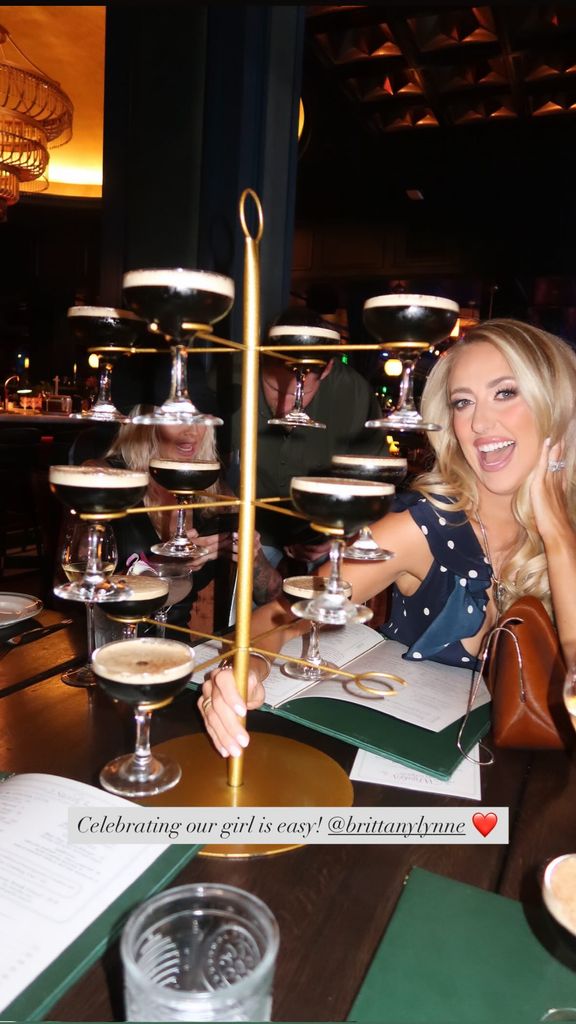 Brittany Mahomes poses with an espresso martini tower
