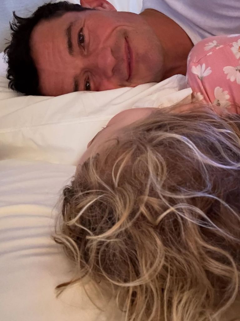 Orlando Bloom lies in bed with his daughter Daisy beside him in a photo shared on Instagram
