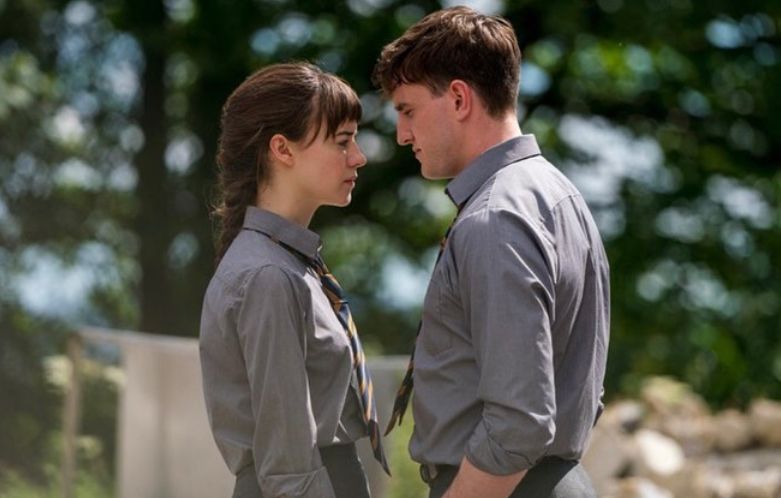 Daisy Edgar-Jones and Paul Mescal in grey school uniforms