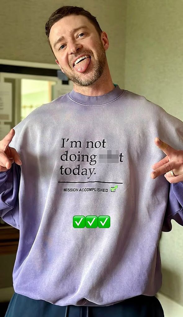 justin timberlake wearing sweater with swearing on