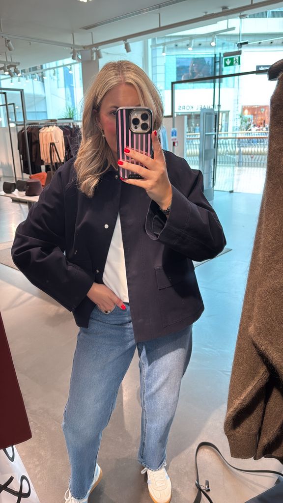 Shopping expert Leanne Bayley wearing a navy cropped jacket from COS.