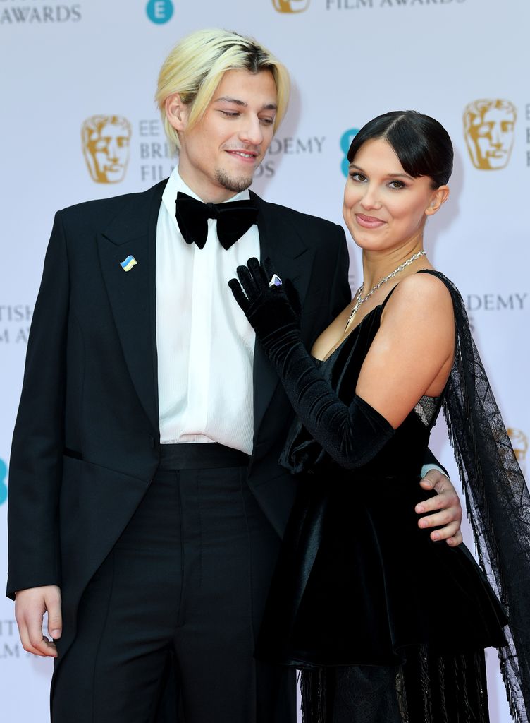 Jake Bongiovi and Millie Bobby Brown attend the EE British Academy Film Awards 2022 at Royal Albert Hall on March 13, 2022 in London, England