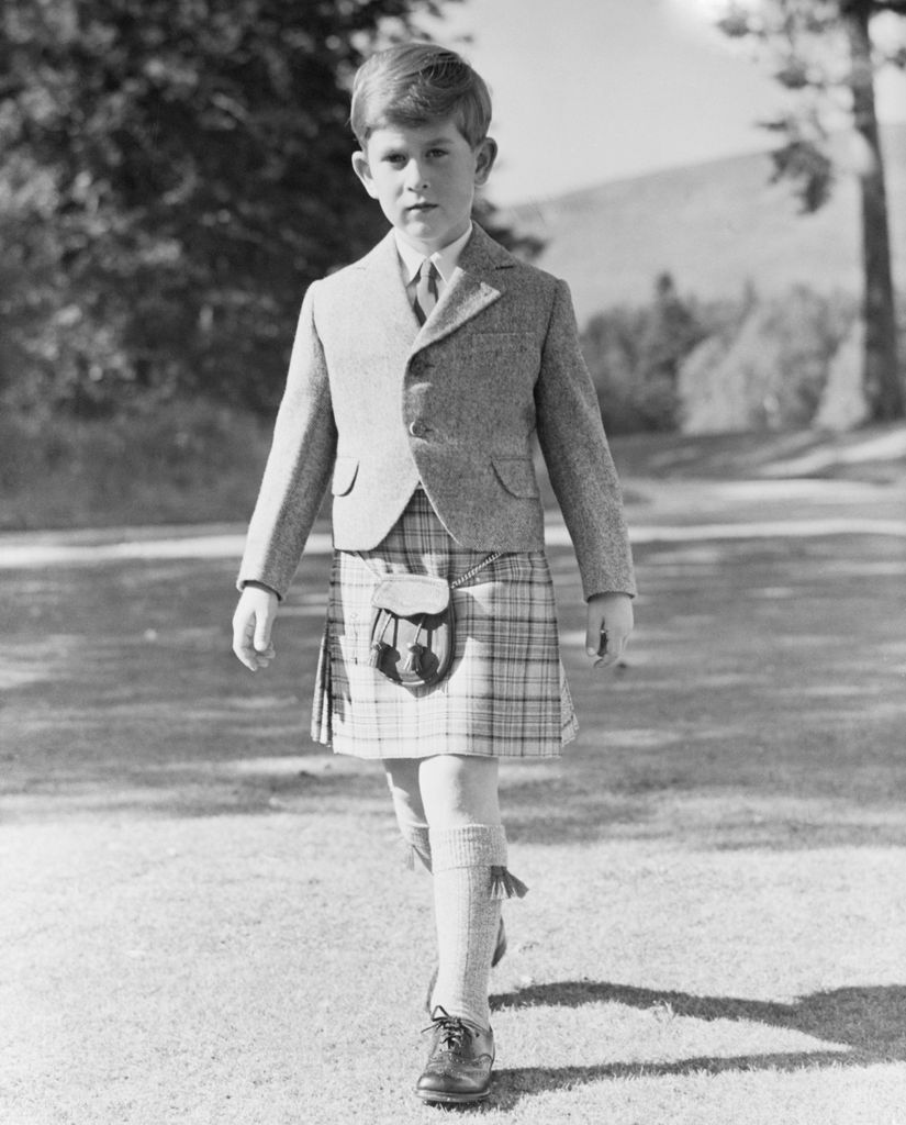 Charles posing for this 7th birthday portrait in the grounds of Balmoral Castle