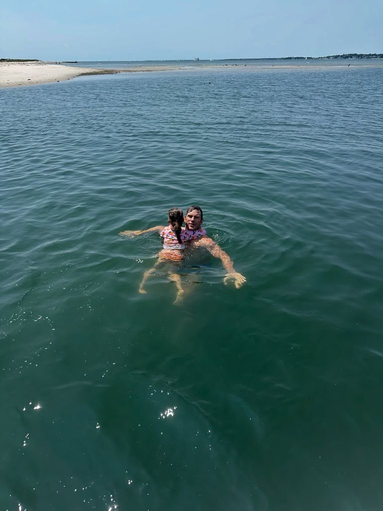 Chris Pratt floats in the water with his daughter