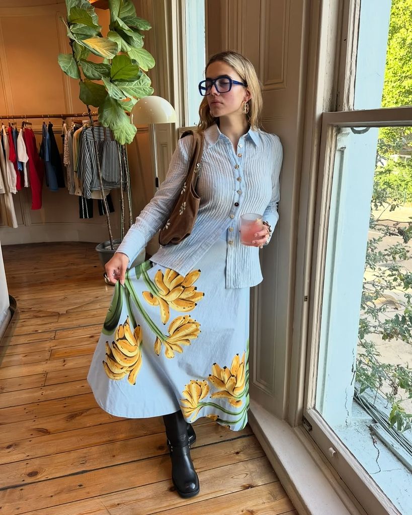 influencer in banana-printed skirt